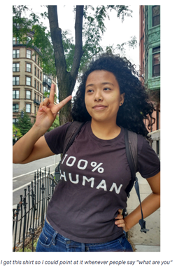 A person with a peace sign
Description automatically generated